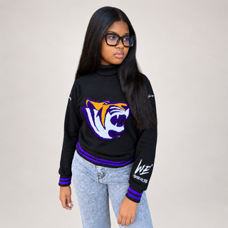 Model wearing the black Benedict College School Daze Turtleneck with a purple and gold Tigers chenille emblem and purple striped trim